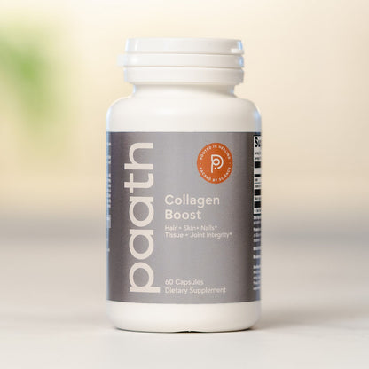 Supplement bottle labeled 'Collagen Boost' on a light background