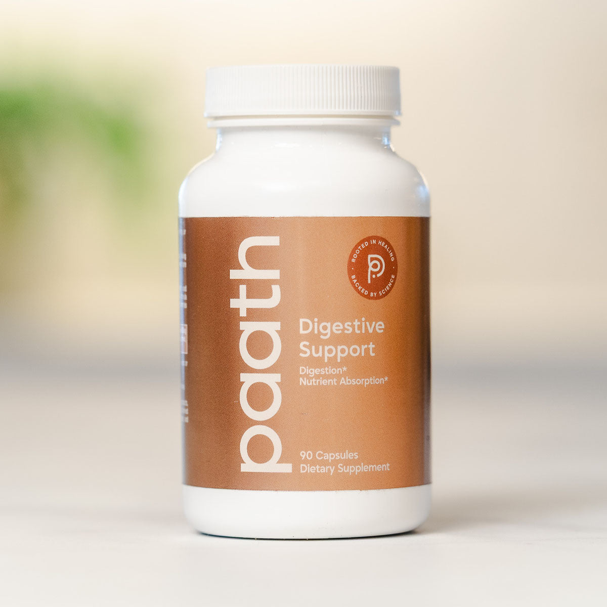 Supplement bottle labeled 'paith' for digestive support on a neutral background