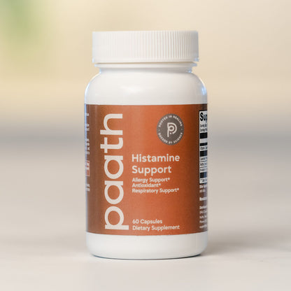 Supplement bottle labeled 'Histamine Support' on a beige background