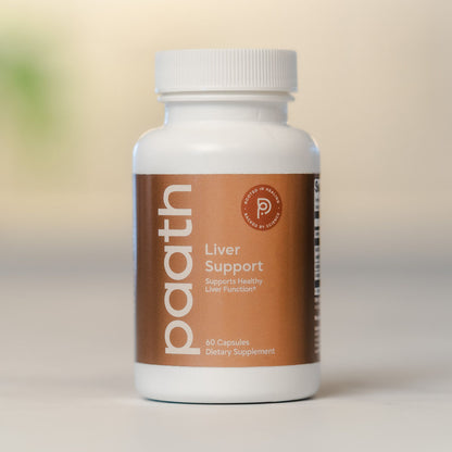 Supplement bottle labeled 'Liver Support' by a brand on a neutral background