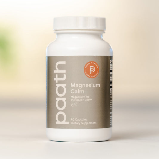 Supplement bottle labeled 'paath Magnesium Calm' on a light background