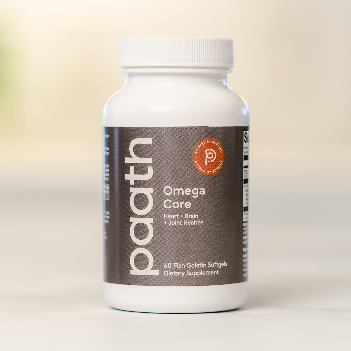 Supplement bottle labeled 'Omega Core' by 'paath' on a light background