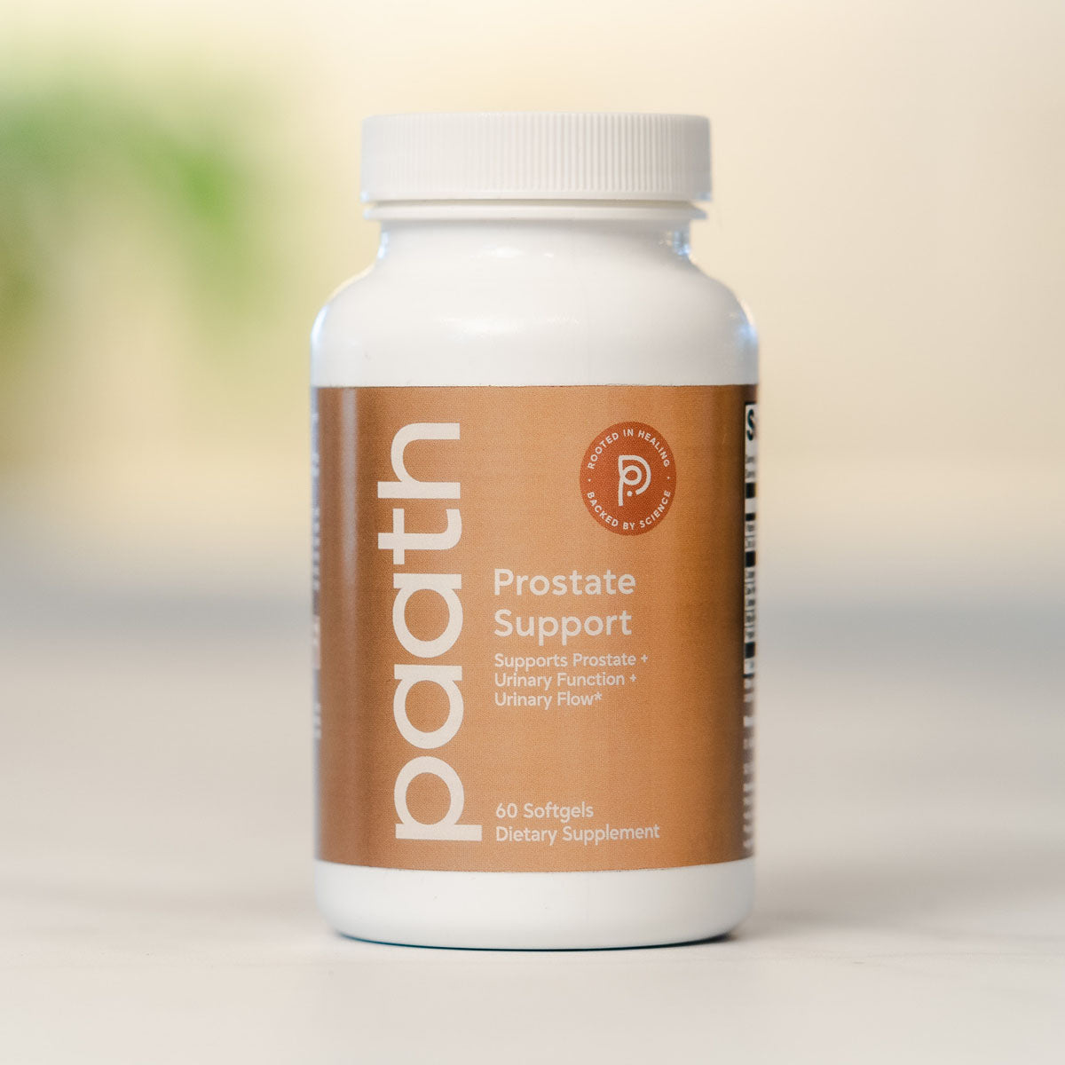 Supplement bottle labeled 'Prostate Support' on a blurred background