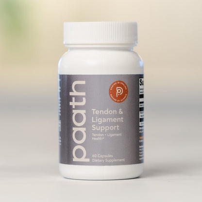 Supplement bottle labeled 'paath' for tendon and ligament support on a neutral background