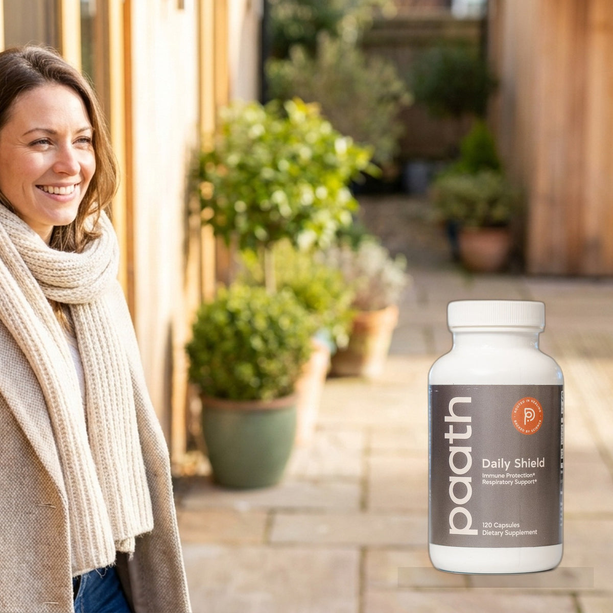 Healthy woman stepping outside in crisp bright daylight with Paath Daily Shield