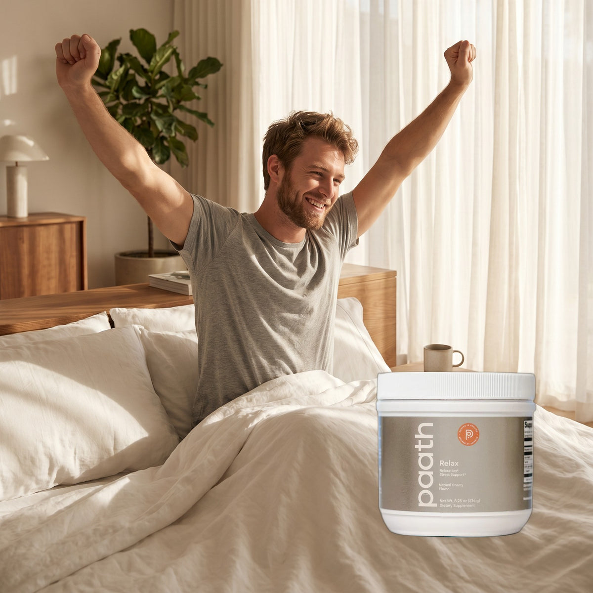 Man waking rested and stretching in bed beside Paath Relax