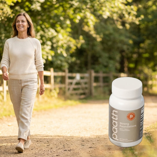 Active woman walking briskly outdoors, upright and strong, with Paath Strong Foundations