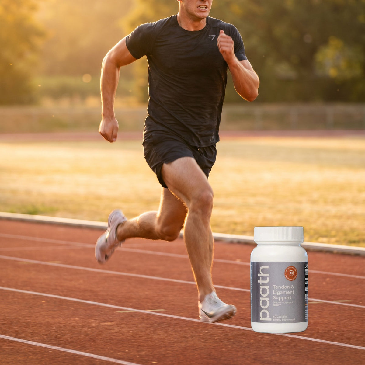 Runner on a track beside Paath Tendon and Ligament Support